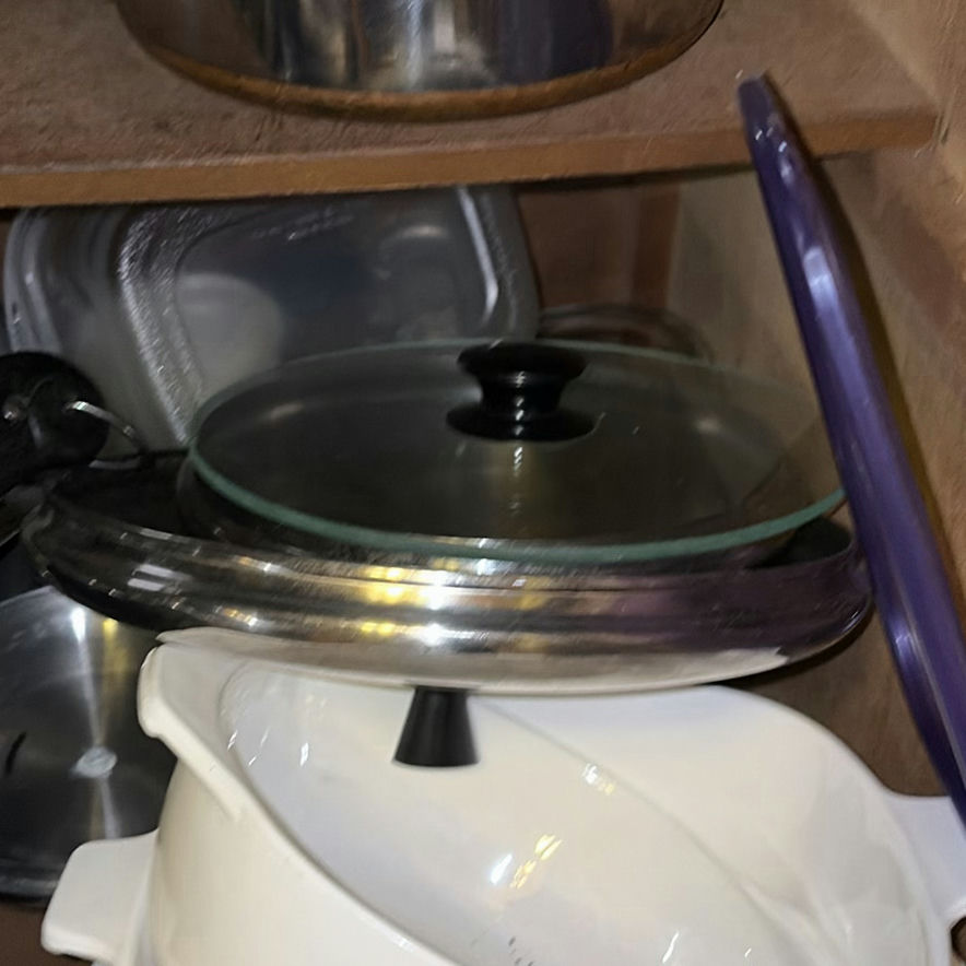 Assorted cookware and enamelware in a cabinet - image 10 of 10