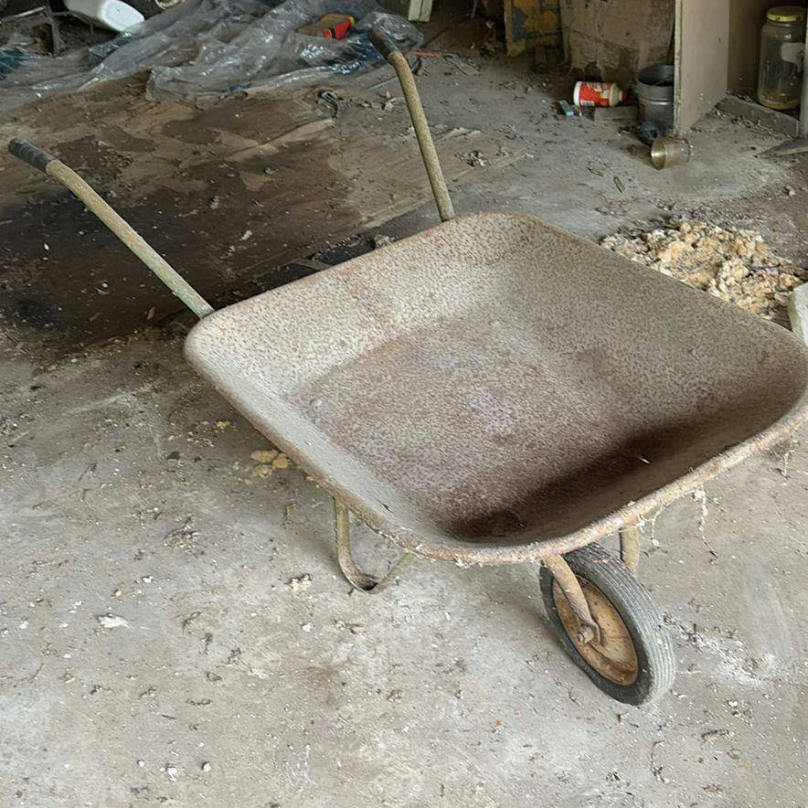 Wheelbarrow, life ring, and Slap Shot Hockey board - image 1 of 6