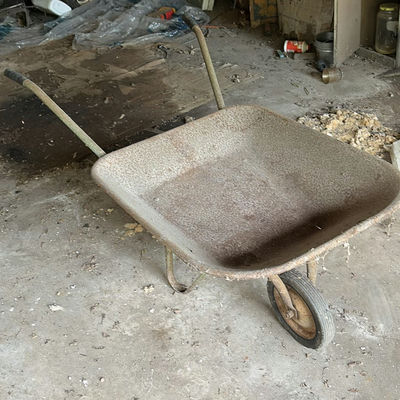 Wheelbarrow, life ring, and Slap Shot Hockey board - Image 1 of 6