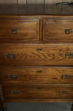 Oak dresser with multiple drawers and ornate hardware - thumbnail 3 of 6