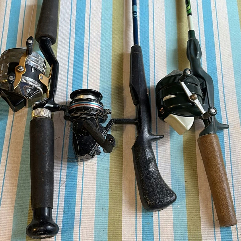 Four fishing rods with reels - image 1 of 6