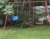 Red metal playground swing set with multiple swings and gym rings - thumbnail 2 of 5