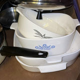 Assorted cookware and enamelware in a cabinet - thumbnail 8 of 10