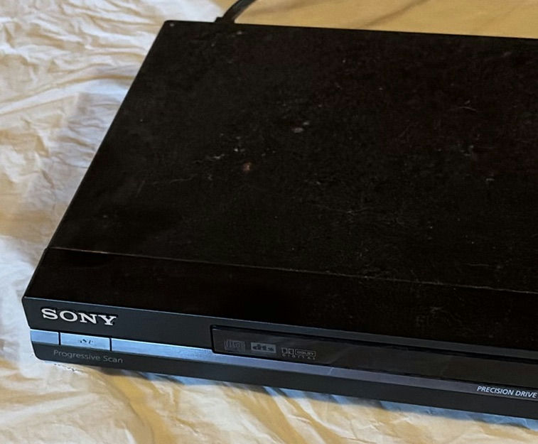 Sony DVD player with remotes and mixed DVD collection - image 3 of 6