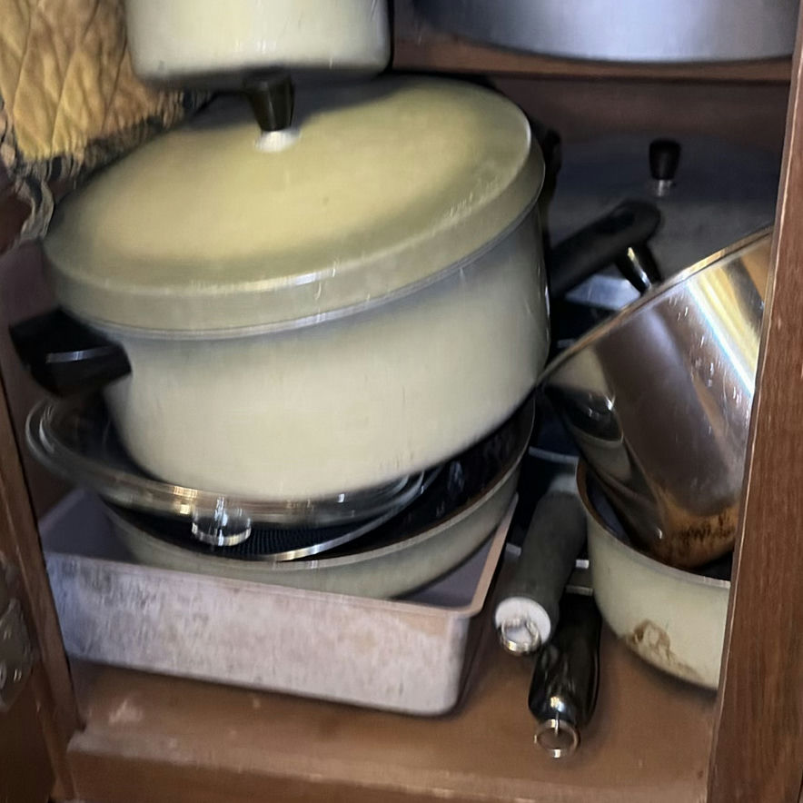 Assorted cookware and enamelware in a cabinet - image 2 of 10